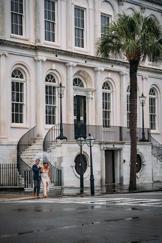 bride and groom in rain on their wedding in niagara on the lake