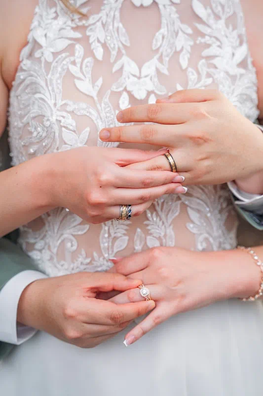 close up of brides and grooms rings