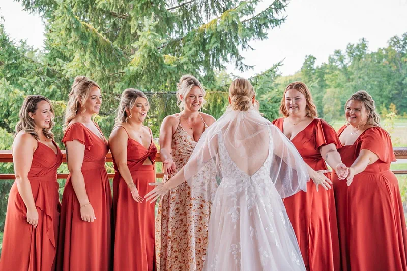 brides first look with bridesmaids at Legends golf course