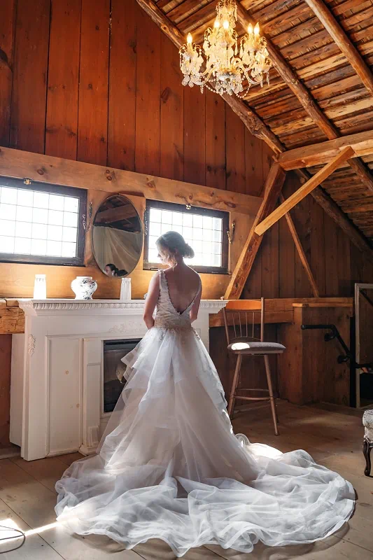 bride getting ready in the loft at Maple Meadows Farm