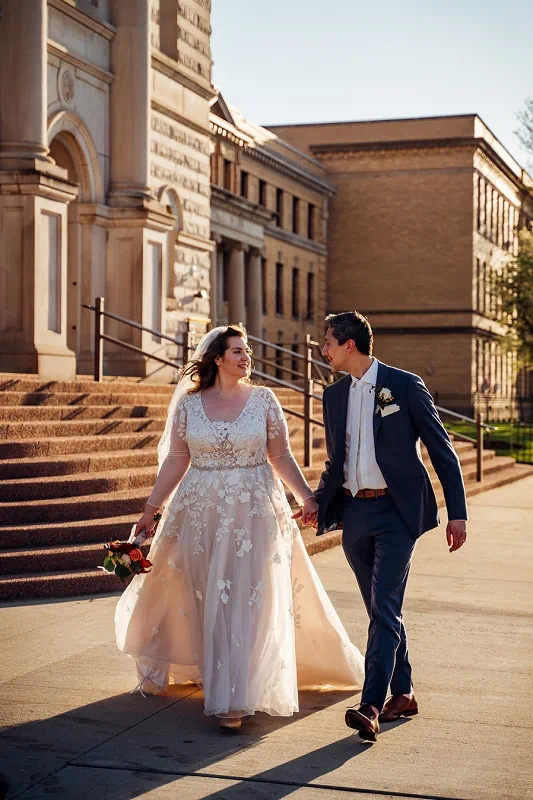 bride and groom walking in Niagara Falls