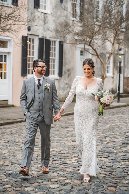 notl wedding photography bride and groom walking down cobblestone street
