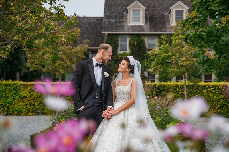 bride and groom kissing in front of Niagara Falls during their elopement